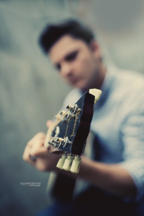 Beautiful teen girl posing with electric guitar - Stock Photo - Dissolve